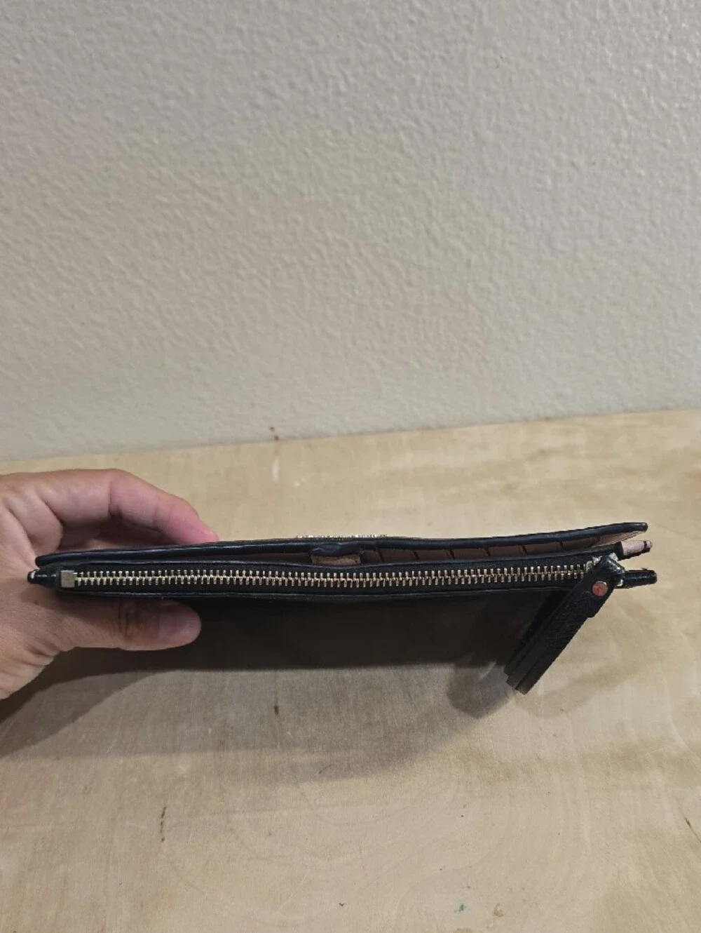 kate spade Black Zip-Around Saffiano Wallet with Pink Accent